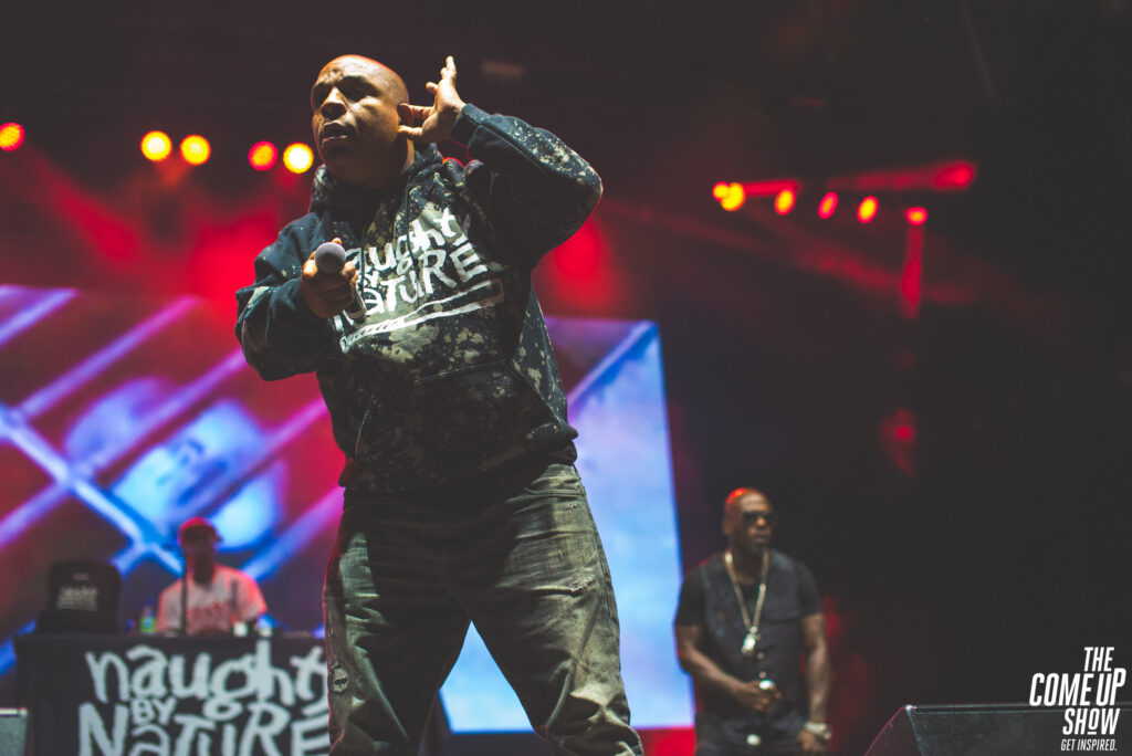 Vin Rock performs with Treach and DJ Kay Gee onstage during a Naughty by Nature concert.