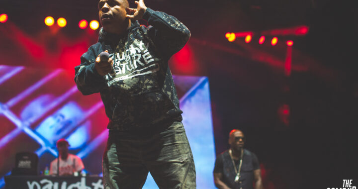 Vin Rock performs with Treach and DJ Kay Gee onstage during a Naughty by Nature concert.