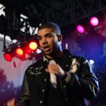 Drake performing onstage in 2010