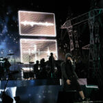 Eminem performing live onstage with a microphone