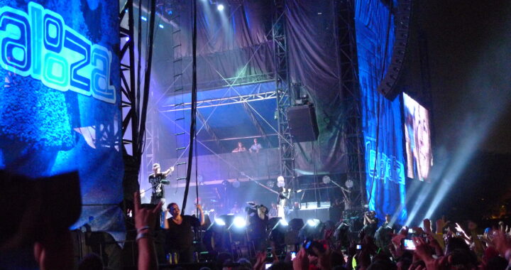 Eminem performing onstage at the 2011 Lollapalooza festival