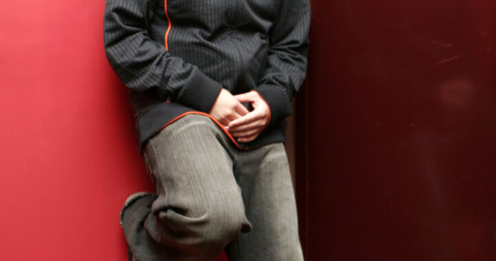 MC Jin performing onstage with a microphone