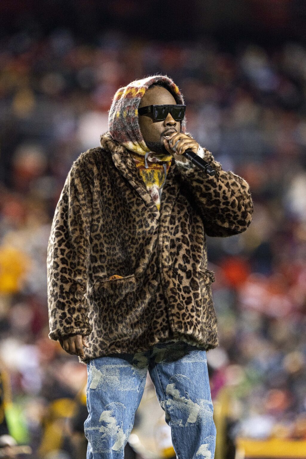 Rapper Wale performs at halftime during a 2021 Monday Night Football game at FedEx Field.